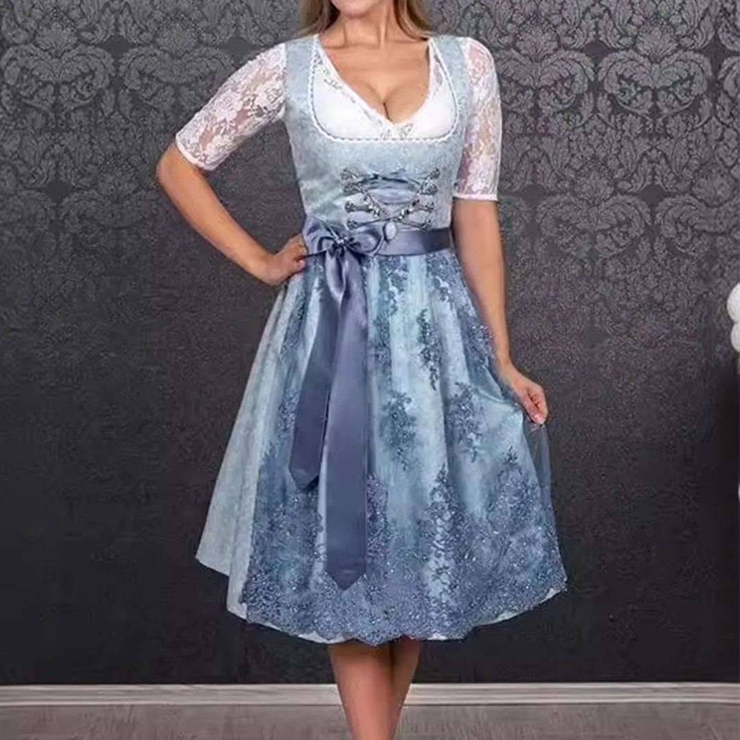 Stylish ladies' dirndl for Oktoberfest with fashionable apron and trendy lace bodice