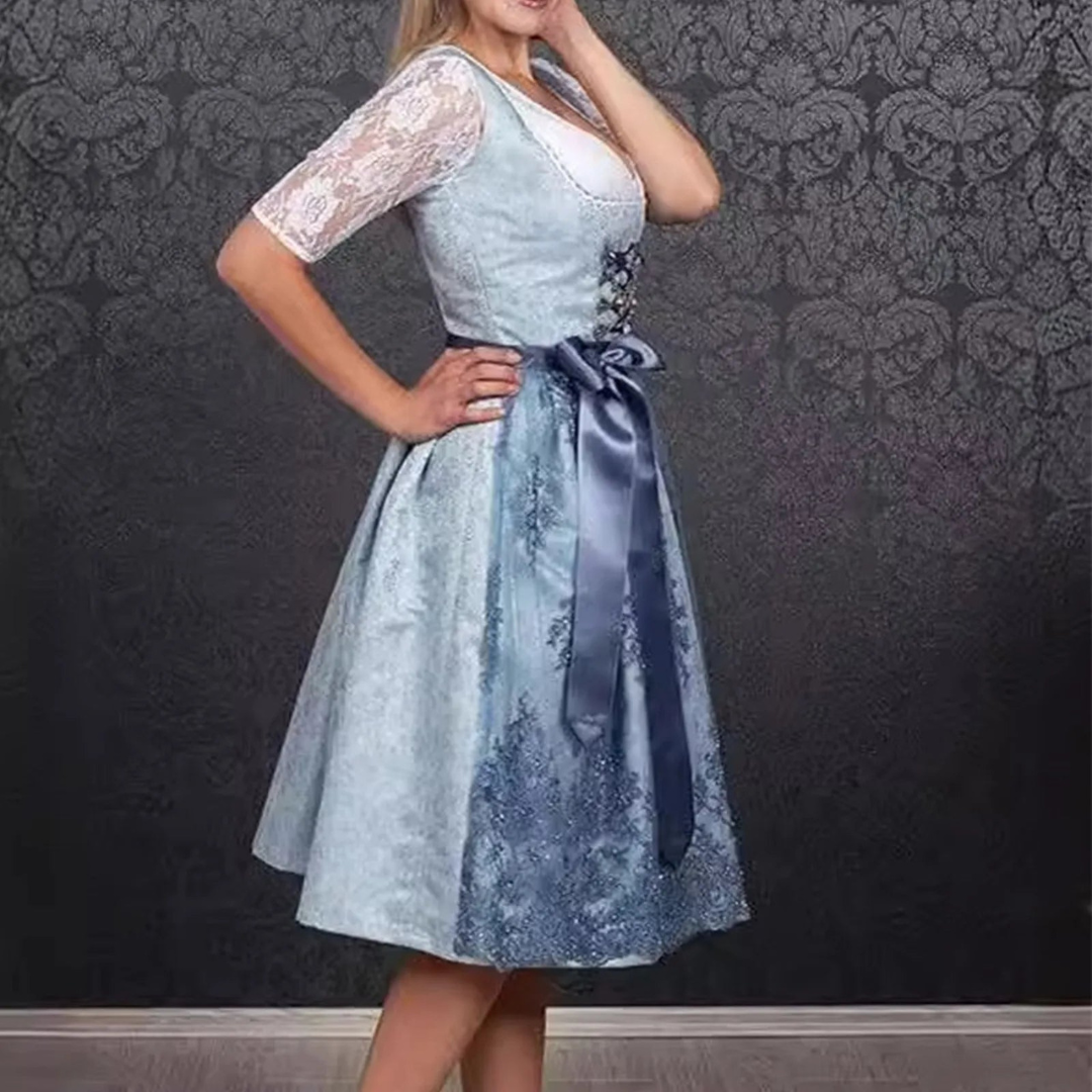 Stylish ladies' dirndl for Oktoberfest with fashionable apron and trendy lace bodice